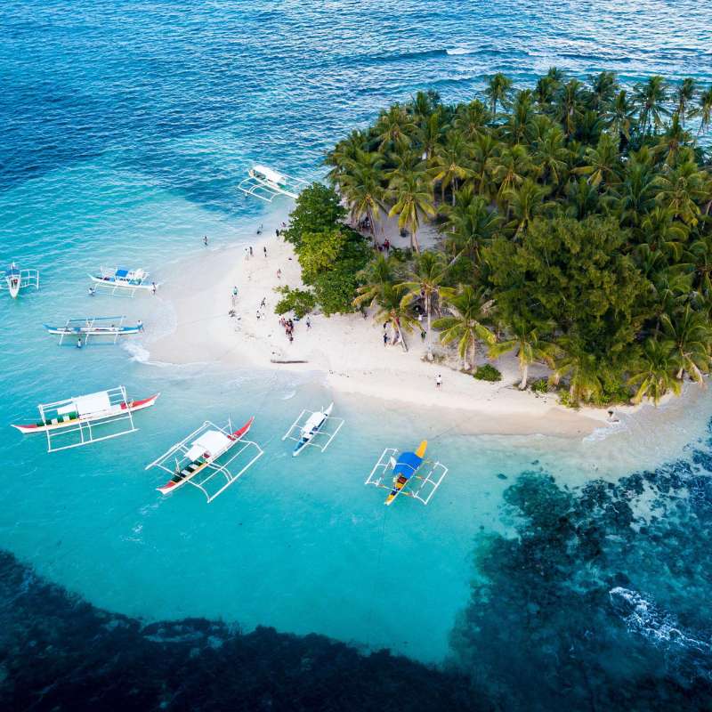 Siargao surf waves and palm-fringed roads