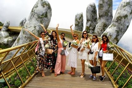 Group visitors on the Golden Bridge, Ba Na Hills