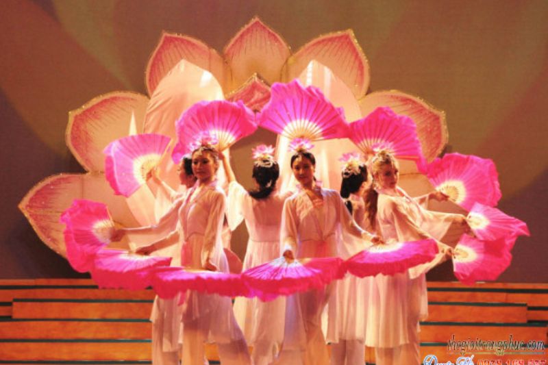 Lotus dance performance with dancers forming lotus shapes symbolizing purity and Vietnamese cultural identity
