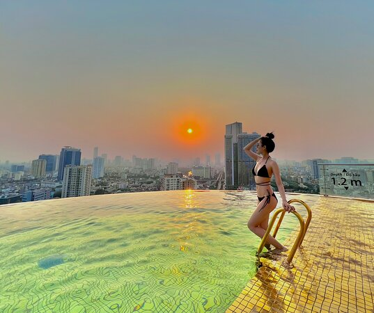 Rooftop 24K gold-tiled infinity pool at Dolce by Wyndham Hanoi Golden Lake