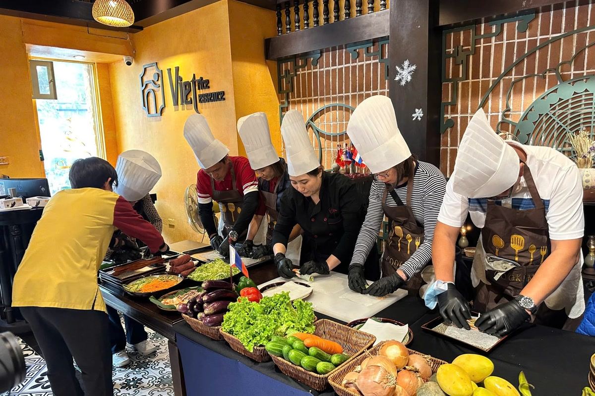 Chefs leading a group cooking class