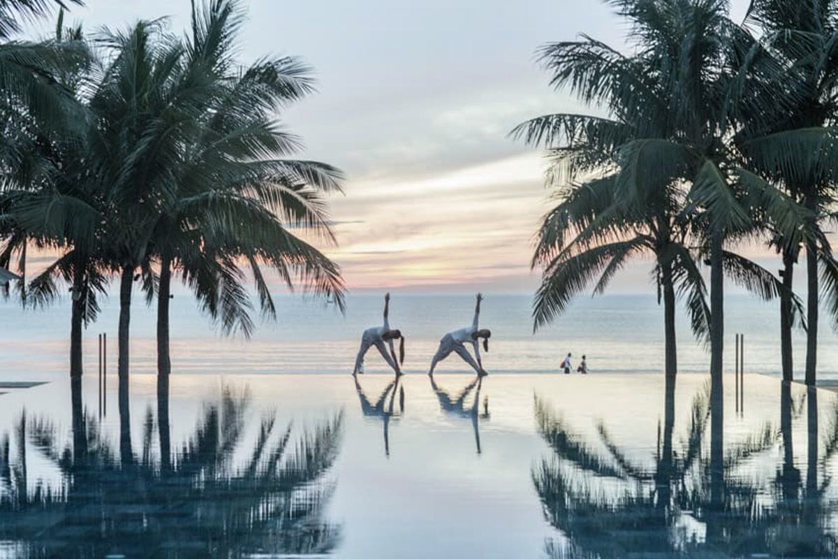 Sunrise yoga by the pool at TIA Wellness Resort